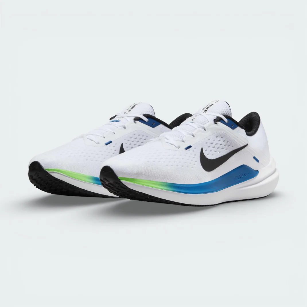 Angled view of two Nike Winflo 10 Men's trainers side by side, showcasing the sleek white design and vibrant Star Blue highlights.