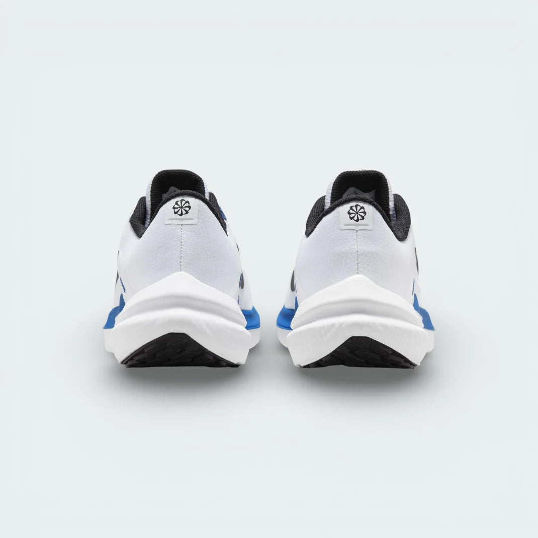 Rear view of the white trainers focusing on the structured heel support and the Star Blue detailing along the collar.