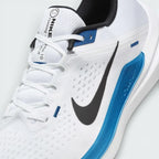 Close-up of the front of the Nike Winflo 10, showing the detail of the white engineered mesh and the sturdy laces for midfoot lockdown.