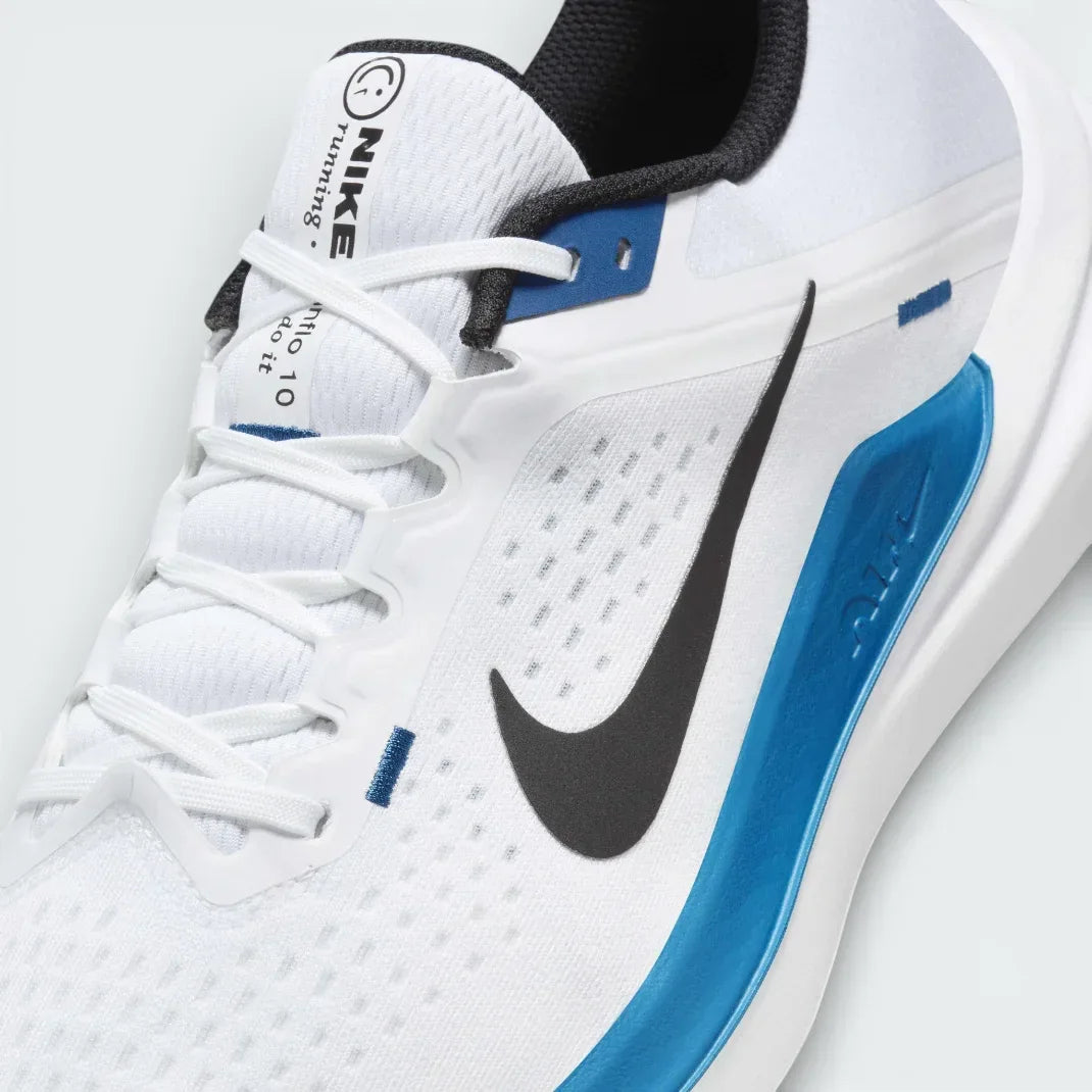 Close-up of the front of the Nike Winflo 10, showing the detail of the white engineered mesh and the sturdy laces for midfoot lockdown.