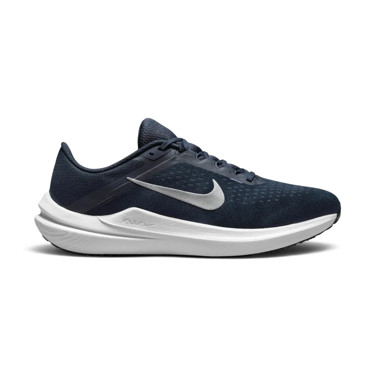 Nike Air Winflo 10 Men's running shoes in midnight navy with white accents, side profile showing engineered mesh upper, prominent Nike Swoosh, and cushioned Air midsole. Main image