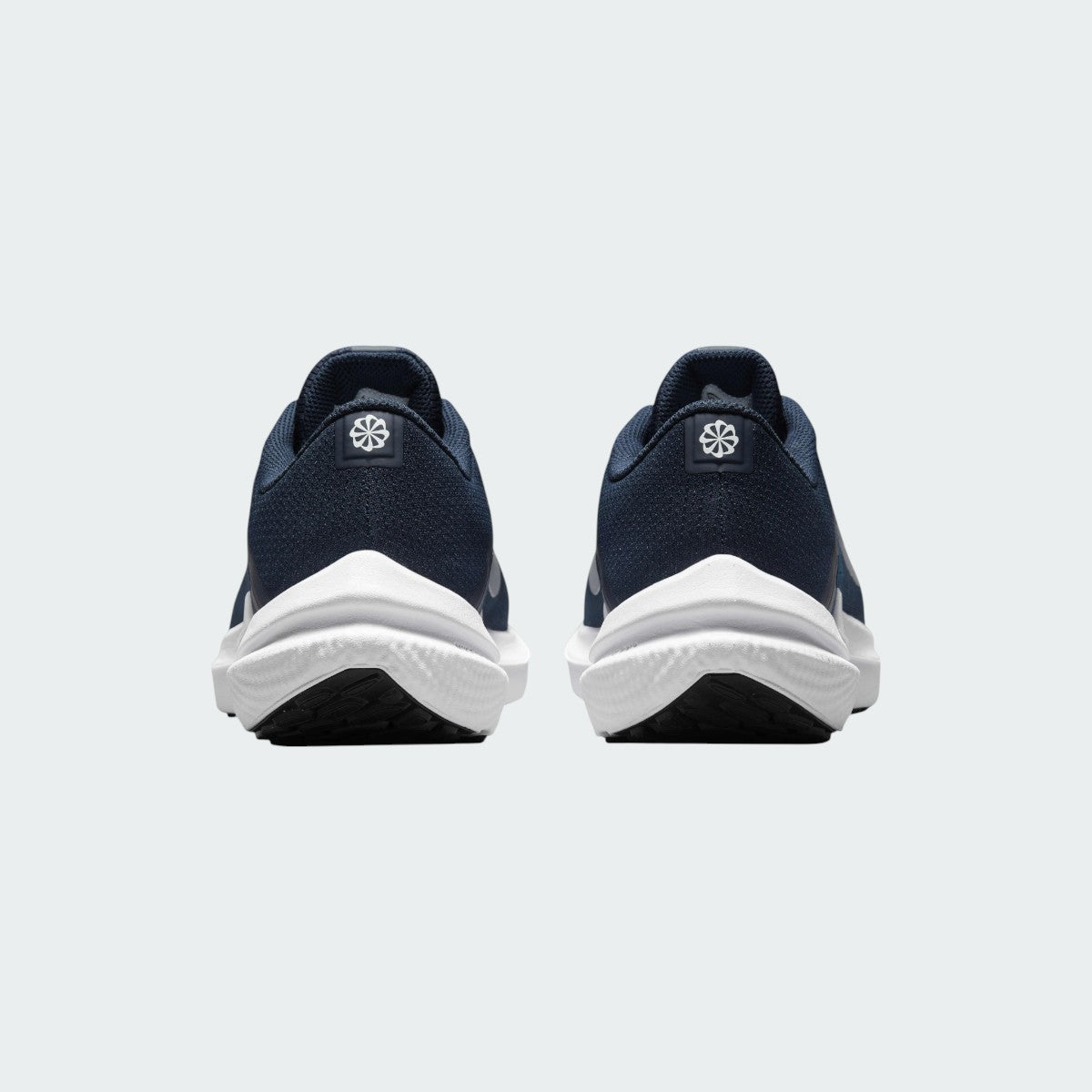 Rear view of the Nike Air Winflo 10 Men's navy running shoes, focusing on the supportive heel collar and design.