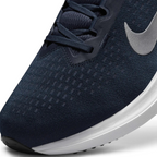 Close-up zoom on the front of the Nike Air Winflo 10 Men's navy running shoes, showing the mesh upper texture, lacing system, and synthetic overlays.
