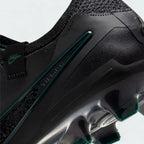 Detailed zoom on the sole of the Nike Legend 10 Elite FG men's boots, highlighting the firm ground stud pattern and transition to the cushioned midsole.