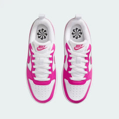 Top-down view of a pair of Nike Court Borough Low Recraft Juniors' trainers in white and pink, highlighting the lace-up closure and perforated toe box.