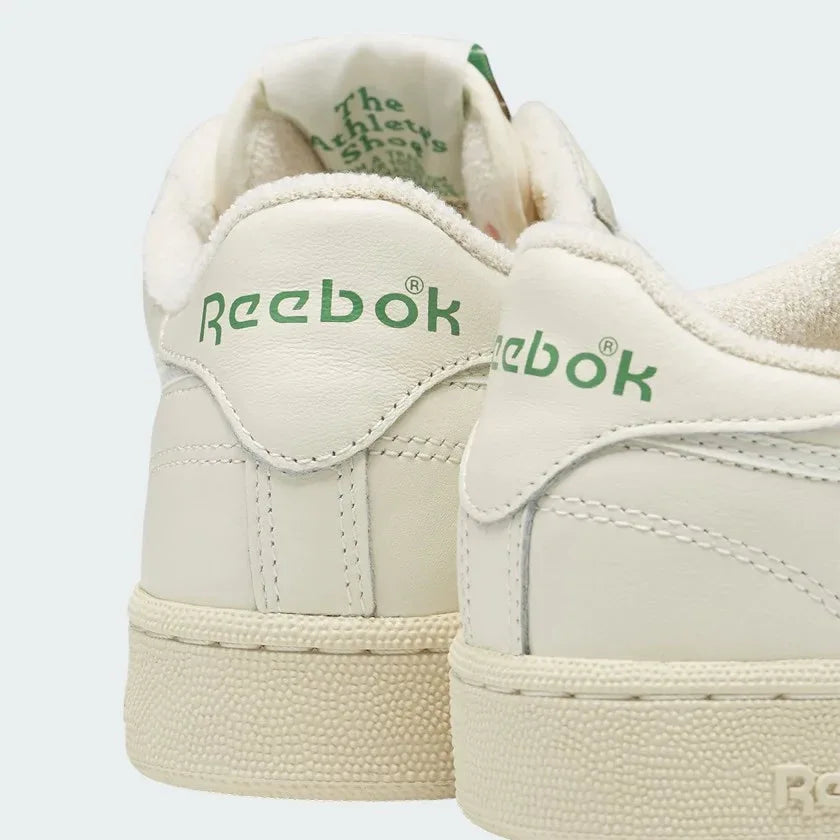 Rear view of the Reebok Classic Club C 85 Vintage chalk trainers, focusing on the heel tab with embossed Reebok branding.