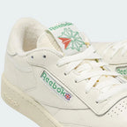 Close-up zoom on the front of the Reebok Classic Club C 85 Vintage chalk trainers, showing the perforated toe box and lacing system.