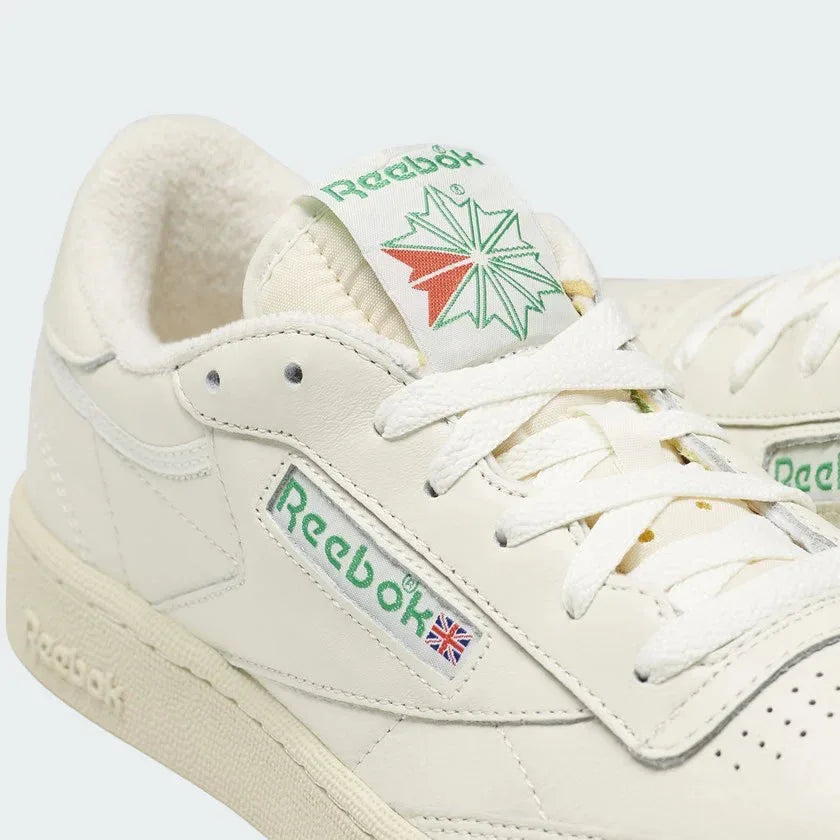 Close-up zoom on the front of the Reebok Classic Club C 85 Vintage chalk trainers, showing the perforated toe box and lacing system.