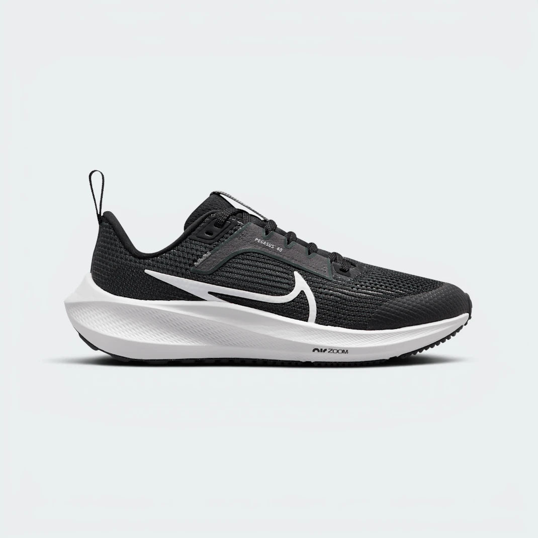 Highlights the high-velocity sweep of the crisp White Nike Swoosh, showing the technical, multi-toned texture of the Black and Iron Grey mesh upper resting above the clean white foam midsole wall. Main image