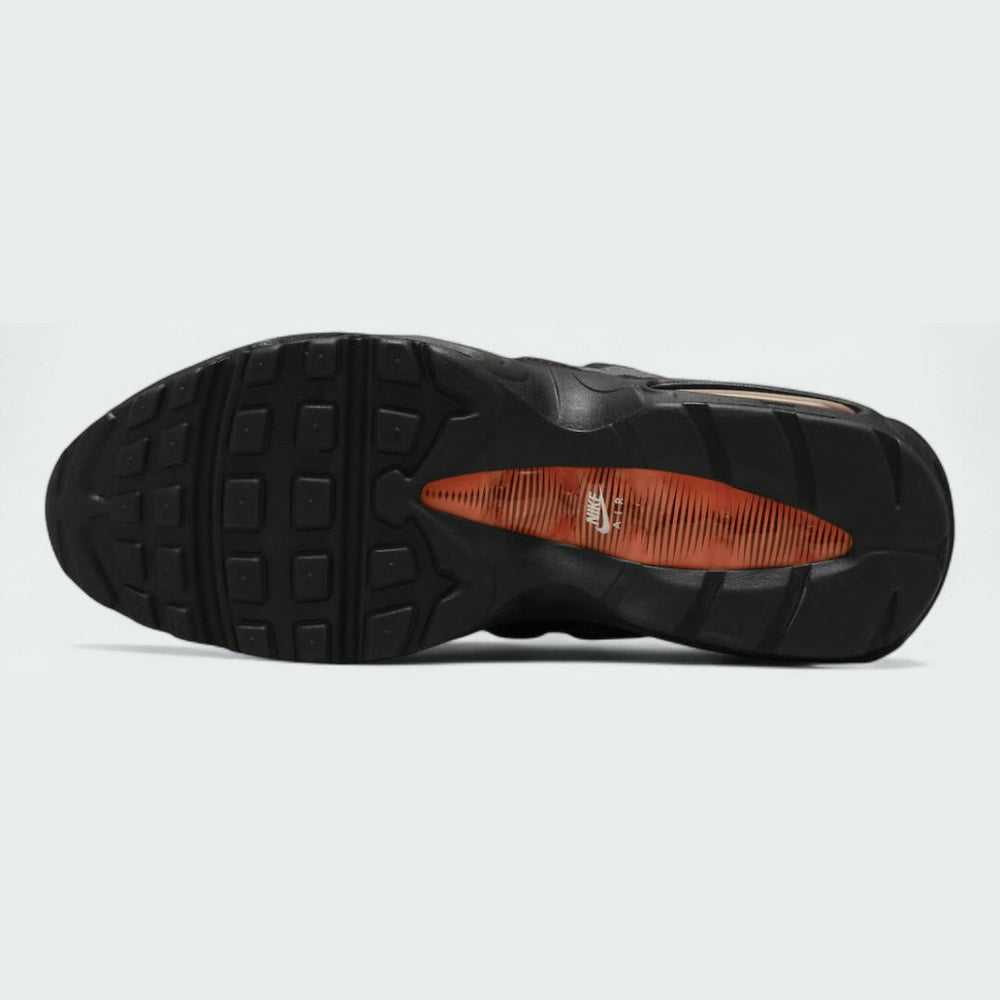 View of the outsole of the Nike Air Max 95 Men's black running shoes, showing the durable rubber waffle tread pattern.