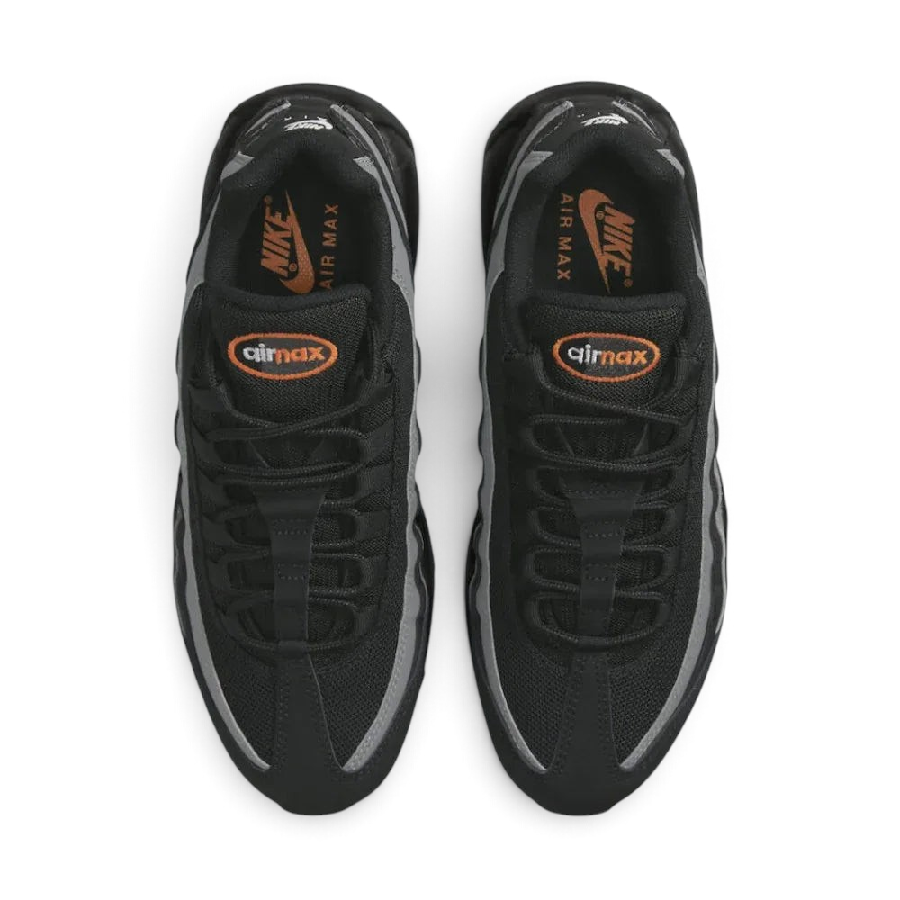 Top-down view of a pair of Nike Air Max 95 Men's running shoes in black, highlighting their iconic silhouette and lacing system.