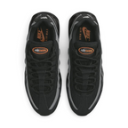 Top-down view of a pair of Nike Air Max 95 Men's running shoes in black, highlighting their iconic silhouette and lacing system.