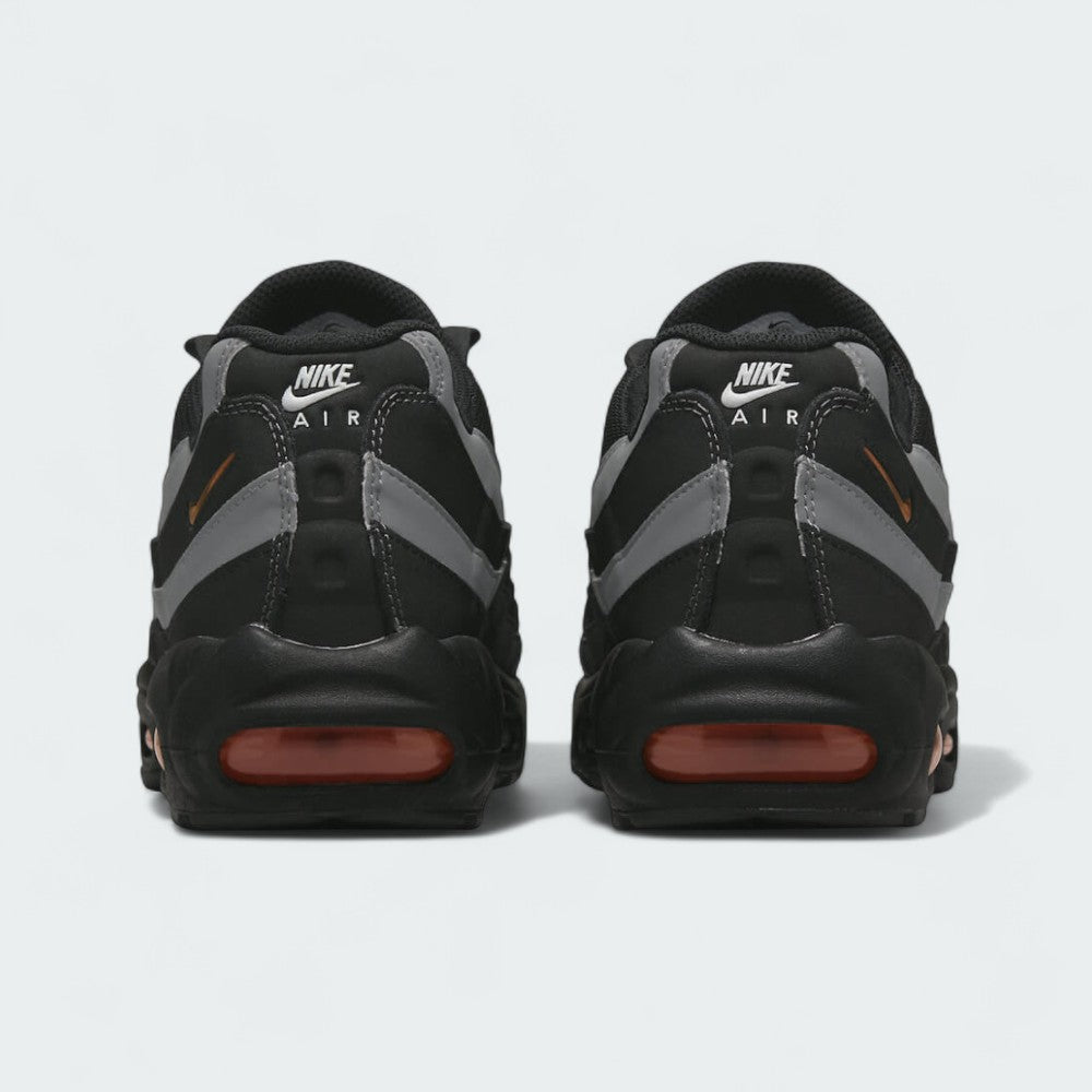 Rear view of the Nike Air Max 95 Men's running shoes, focusing on the prominent heel counter and Nike Air branding.