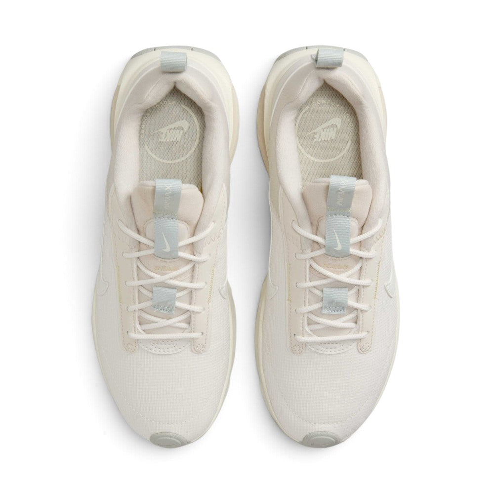 Highlighting the symmetrical central lacing throat, flat tonal laces, padded tongue with Nike Air Max branding, and cushioned sockliner, demonstrating the upper template constructed for a comfortable "locked-in" fit.