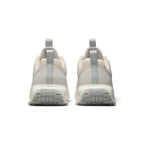 Showing the structured rear heel counter construction, detailing the synthetic heel wrap, integrated webbing pull tab, subtle branding, and visible Air bubble chamber.