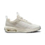 Capturing the modern low-top silhouette, detailing the phantom textile mesh upper, light silver side overlays, subtle Swoosh branding, sculpted sail foam midsole, and visible heel Max Air unit.