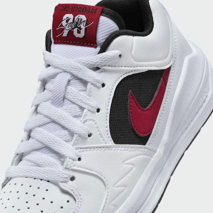 Close-up zoom on the front of the Jordan Stadium 90 Juniors' trainers, showing the perforated toe box, lacing system, and textured leather upper.