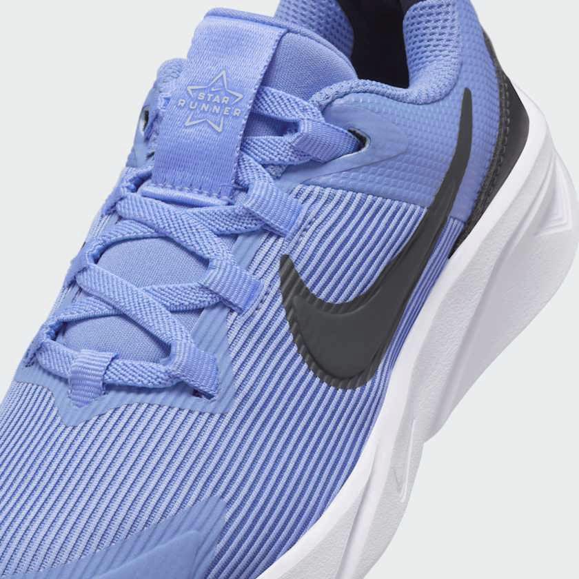 Close-up of Nike Star Runner 4 Next Nature Children's trainers showing breathable mesh and logo detail