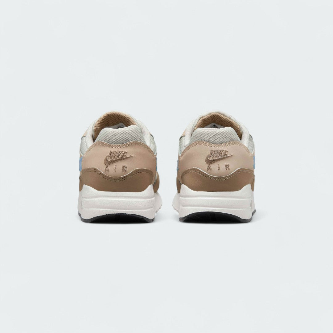 Rear view of the Nike Air Max 1 Juniors' trainers, focusing on the prominent heel counter and Nike Air branding.