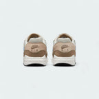 Rear view of the Nike Air Max 1 Juniors' trainers, focusing on the prominent heel counter and Nike Air branding.