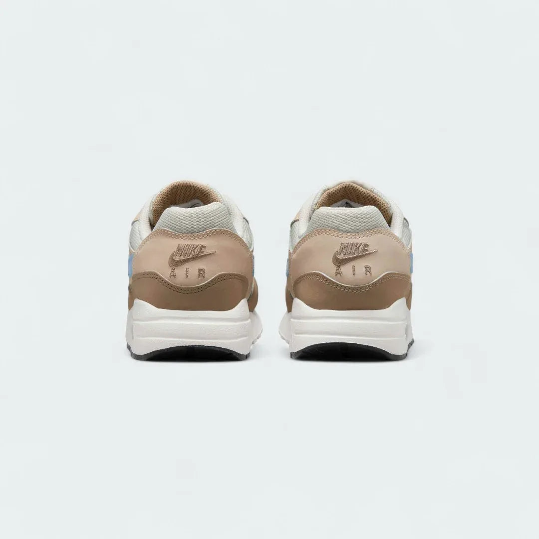 Rear view of the Nike Air Max 1 Juniors' trainers, focusing on the prominent heel counter and Nike Air branding.