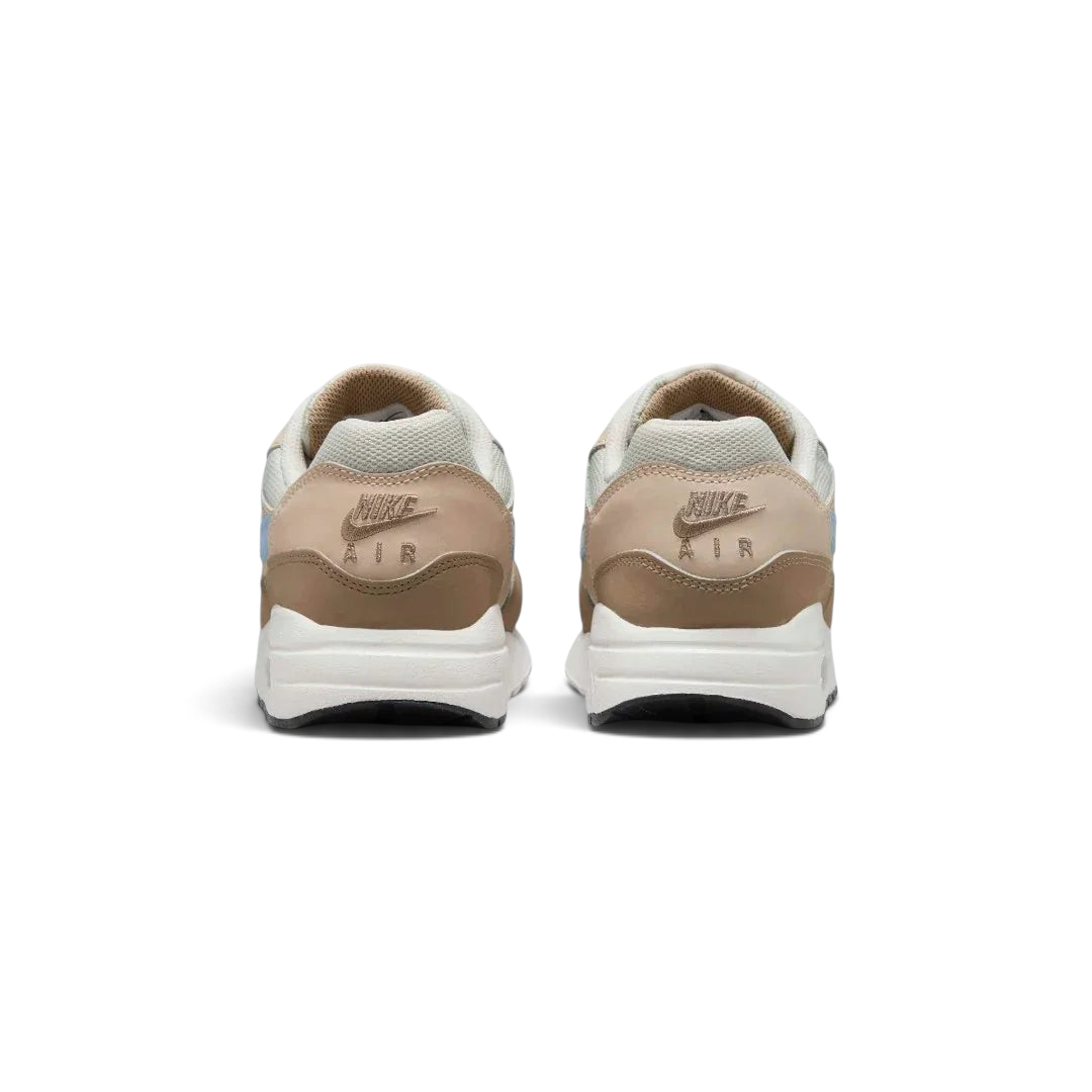 Rear view of the Nike Air Max 1 Juniors' trainers, focusing on the prominent heel counter and Nike Air branding.
