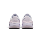 Focuses on the rear profile, highlighting the textured chenille heel counter, moulded pink-lilac heel stability band stamped with "versair" text, and the wide flared base of the foam midsole.