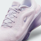 Details the micro-precision of the blanket-soft chenille upper, showing the synthetic lace eyestays, pale lilac laces, and mini Swoosh on the toe tip.