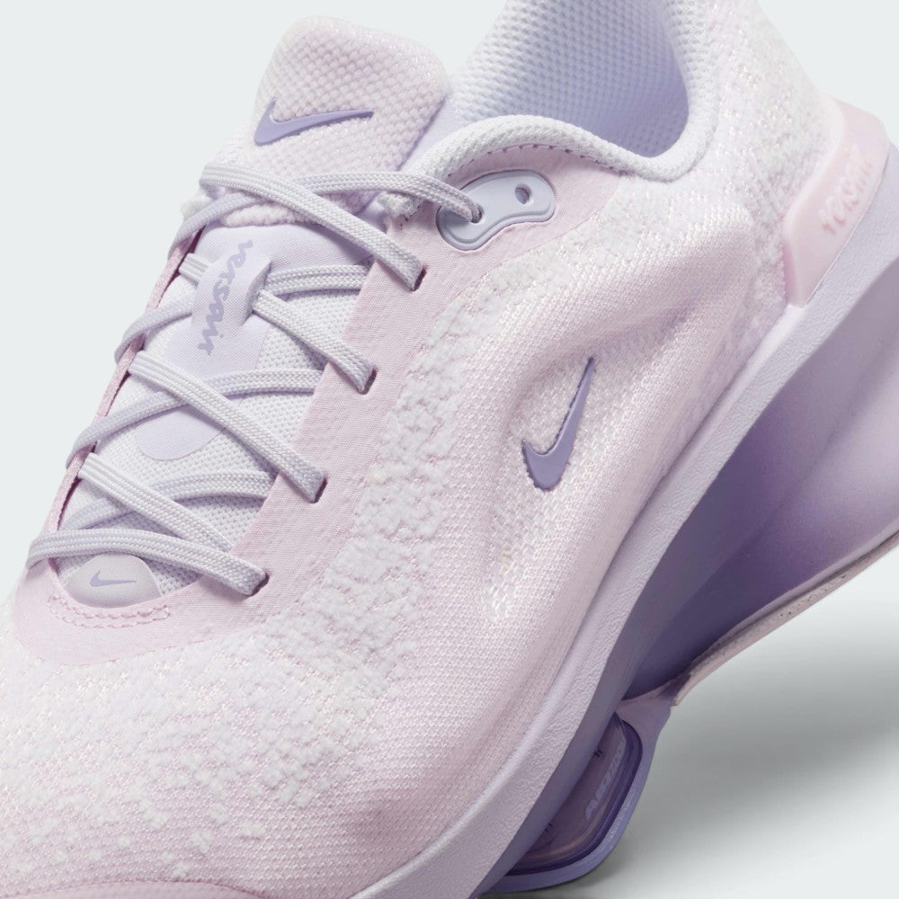 Details the micro-precision of the blanket-soft chenille upper, showing the synthetic lace eyestays, pale lilac laces, and mini Swoosh on the toe tip.