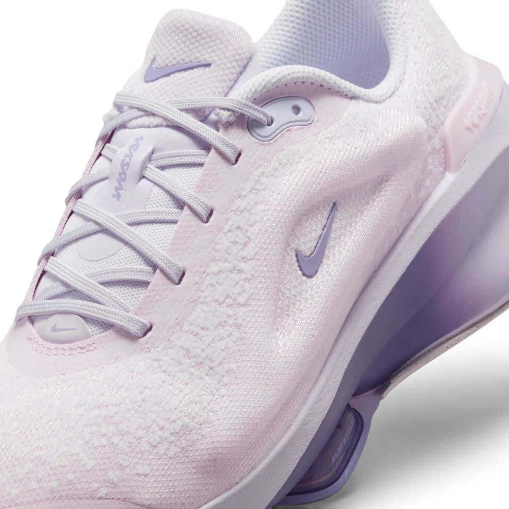 Details the micro-precision of the blanket-soft chenille upper, showing the synthetic lace eyestays, pale lilac laces, and mini Swoosh on the toe tip.