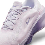 Details the micro-precision of the blanket-soft chenille upper, showing the synthetic lace eyestays, pale lilac laces, and mini Swoosh on the toe tip.
