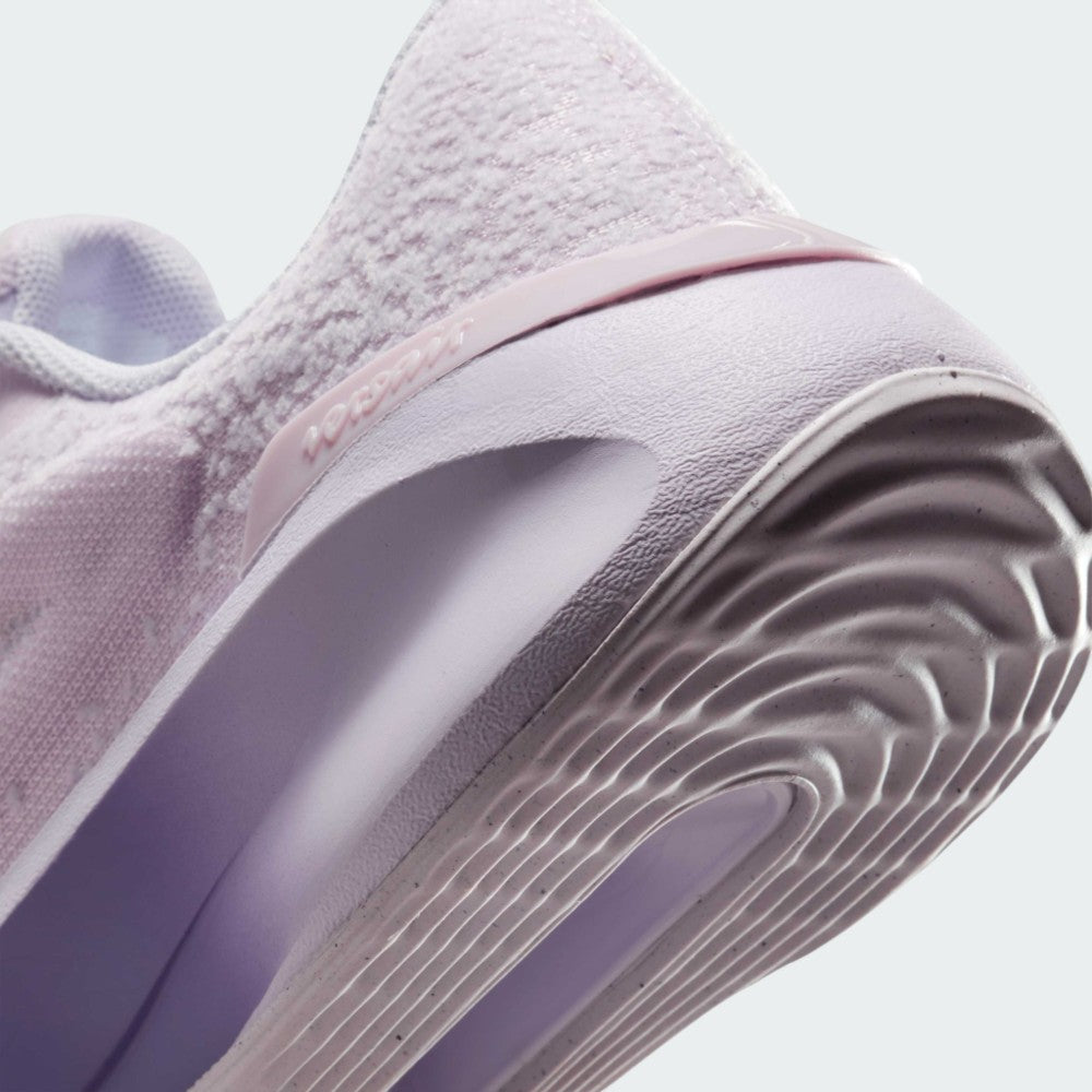 Highlights the "unreal" clean finish where the grooved lilac rubber sole meets the gradient foam midsole, framing the debossed "versair" heel clip.