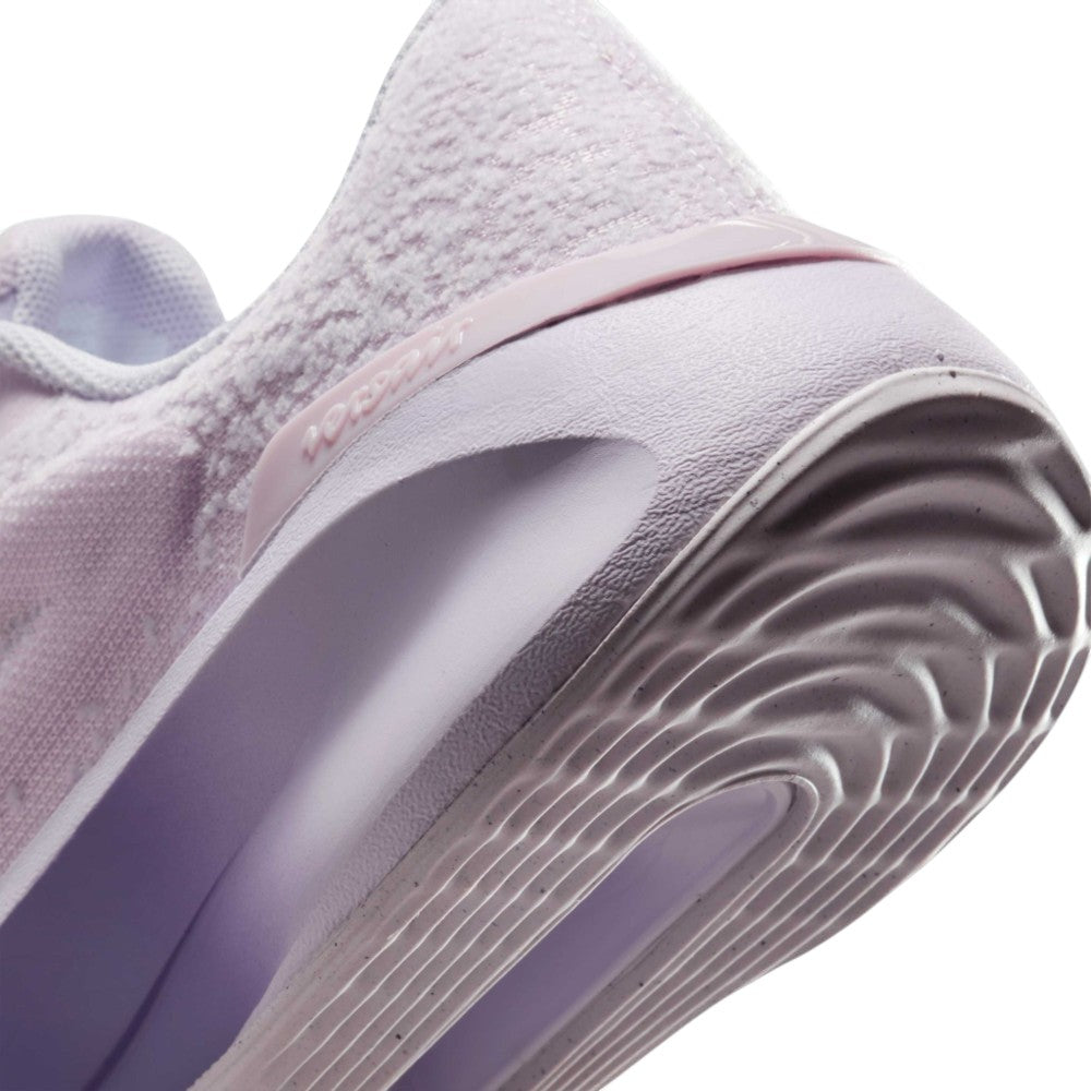 Highlights the "unreal" clean finish where the grooved lilac rubber sole meets the gradient foam midsole, framing the debossed "versair" heel clip.