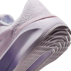 Highlights the "unreal" clean finish where the grooved lilac rubber sole meets the gradient foam midsole, framing the debossed "versair" heel clip.