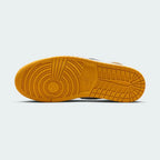View of the outsole of the Air Jordan 1 Retro High OG Men's yellow trainers, showing the durable rubber sole and classic traction pattern.