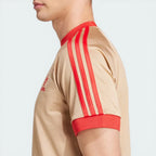 Side profile of the Magic Beige David Beckham tee, highlighting the slim, contoured fit and the clean sleeve finish.