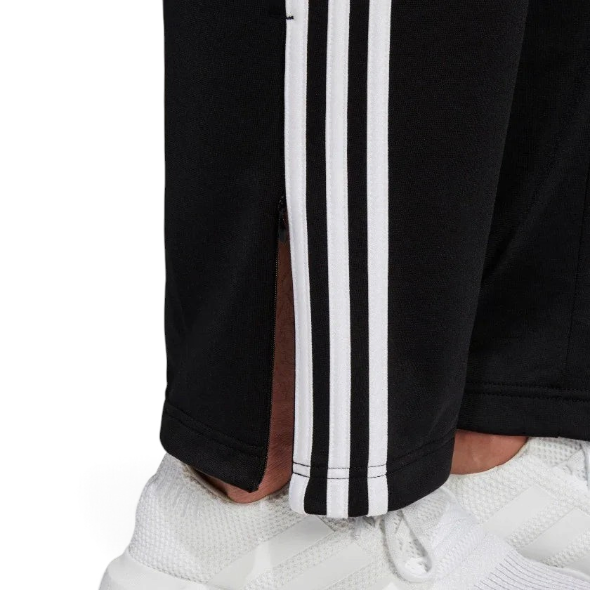 Detailed zoom on the ribbed ankle cuff of the Adidas Firebird Track Pants, highlighting the adjustable fit and clean finish.