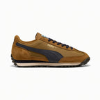 Highlights the slim-profile 1970s lateral silhouette showing the warm Honey Butter textile base, buttery suede toe and heel mudguards, prominent New Navy leather Formstrip, wedge-shaped dual-tone EVA midsole, and studded black rubber outsole.