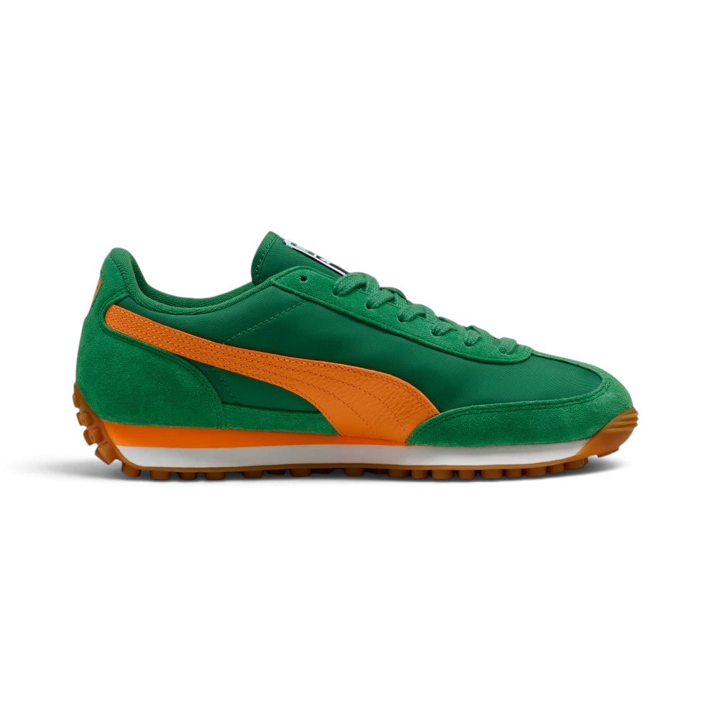 Medial profile displaying the inner Archive Green nylon quarter, arched green suede mudguard, Rickie Orange leather Formstrip, and the clean split-tone white and orange EVA wedge midsole carrier.