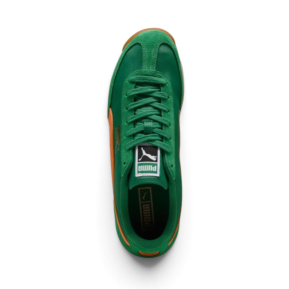 Overhead look at the shoe highlighting the Archive Green textile vamp, reinforced suede T-toe mudguard, central lacing system with flat tonal green laces, vintage woven PUMA tongue label, and dark green cushioned footbed.