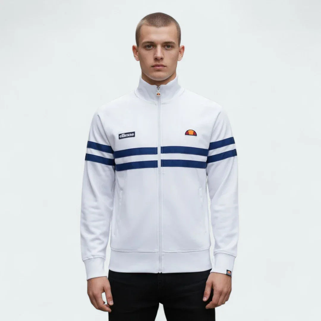 Ellesse Rimini Track Jacket Men's in white, front view shown a male model showing the full zip, stand-up collar, and iconic blue and red stripes across the chest and sleeves. Main image