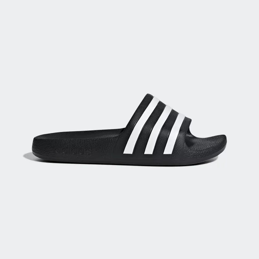 Capturing the sleek monoblock silhouette and the iconic Cloud White 3-Stripes electrification against the Core Black EVA upper.