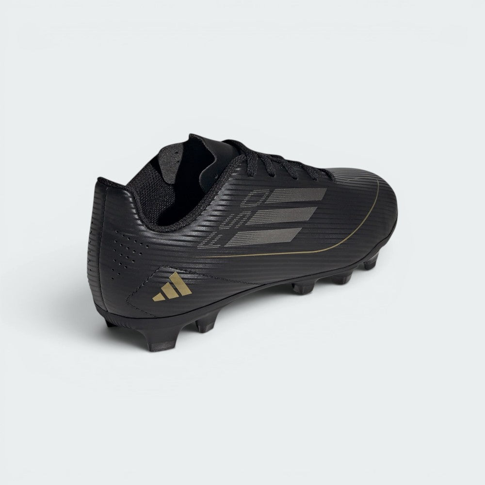 Focuses on the sleek heel construction and the professional finish of the synthetic leather.