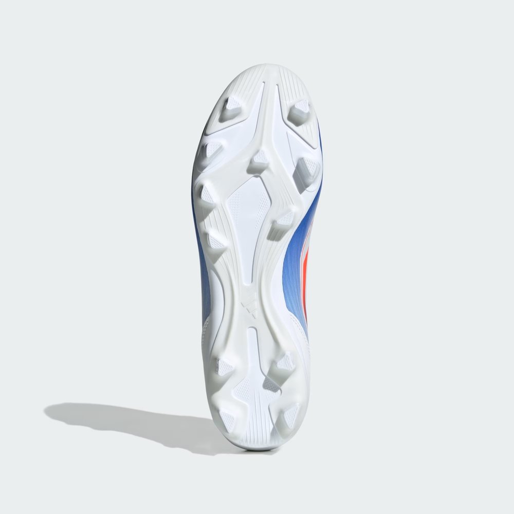 Outsole View: Showing the multi-surface stud pattern designed for both natural and artificial grass surfaces.