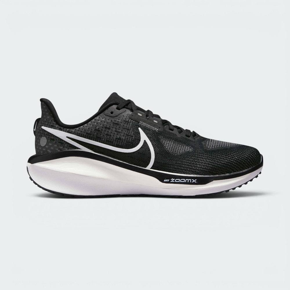 Highlights the high-velocity sweep of the contrasting white Nike Swoosh, showing the professional, multi-textured knit pattern of the black engineered mesh upper, the subtle Anthracite structural overlays, and the thick, high-walled premium dual-density midsole base. Main image