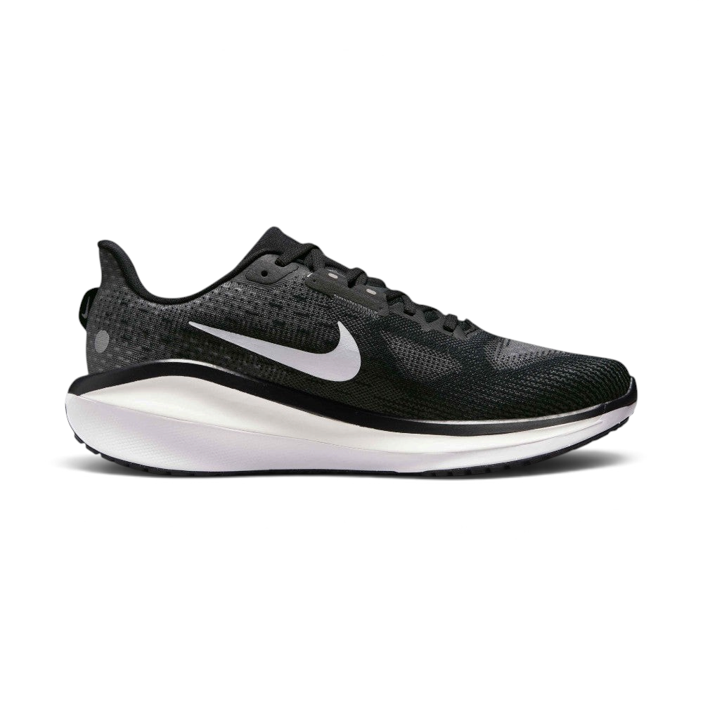 A Nike running shoe in black and white, featuring a textured black mesh upper, a white Nike Swoosh, and a thick white and black midsole, shown from a side profile on a light gray background.