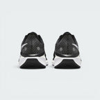 Focuses on the contoured shape of the padded ankle collar, highlighting the thick plush heel lining and the robust, wide footprint of the sole unit engineered for maximum landing stability.