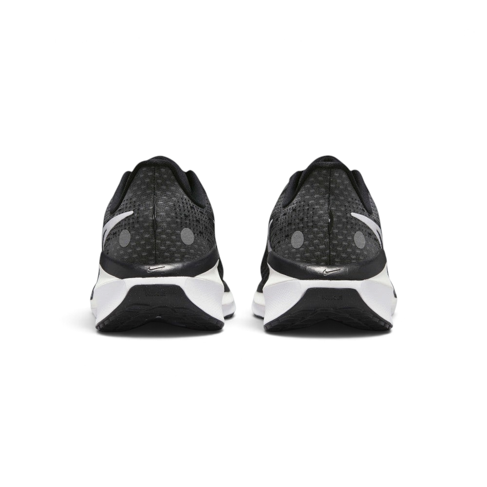 Focuses on the contoured shape of the padded ankle collar, highlighting the thick plush heel lining and the robust, wide footprint of the sole unit engineered for maximum landing stability.
