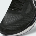 Details the premium precision of the seamless overlays reinforcing the front engineered mesh toe cap to defend against debris, alongside the neat tracking of the black laces.