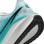 Highlights the heel crash pad area showing the textured white Cushlon 3.0 foam, teal ZoomX rim, black Swoosh tail, circular reflective dot accent, and the black rubber outsole tread stamped with "NIKE".